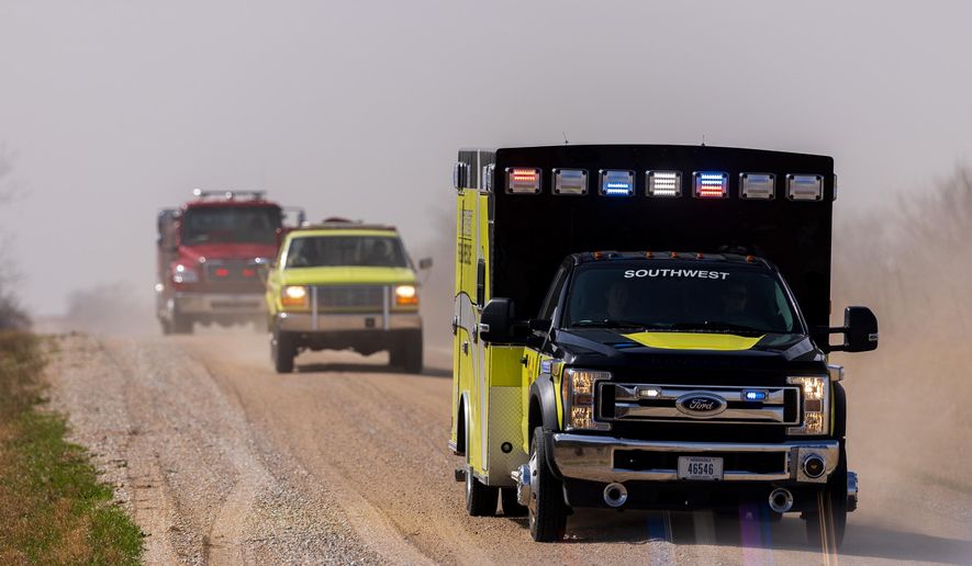 Malcolm and Lincoln firefighters respond to a wildfire in Denton, Neb., on Thursday, March 12, 2026. (Kenneth Ferriera/Omaha World-Herald via AP)