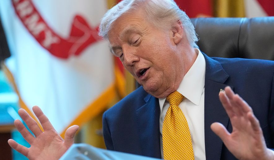 President Donald Trump speaks after signing an executive order regarding a task force on fraud in the Oval Office of the White House, Monday, March 16, 2026, in Washington, with a model of a B-2 stealth bomber in front of him. (AP Photo/Julia Demaree Nikhinson)