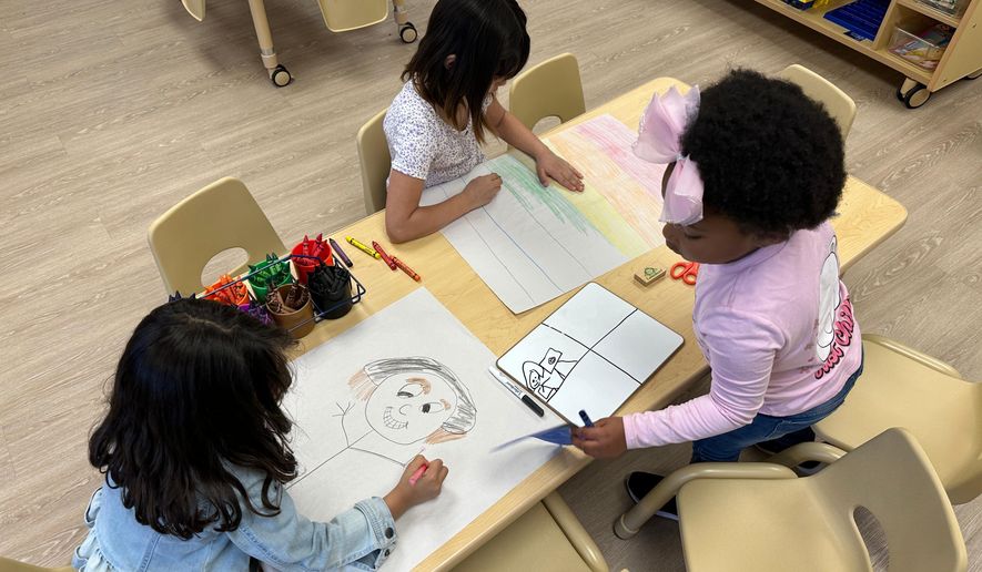Children draw in one of the classrooms at the Children's Promise Centers child care center in Albuquerque, N.M., April 5, 2024. (AP Photo/Susan Montoya Bryan, File)
