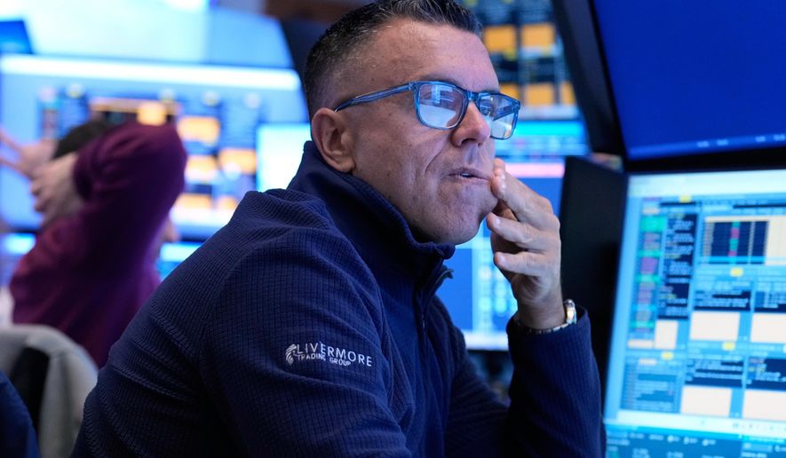 Traders work on the floor at the New York Stock Exchange in New York, Tuesday, March 10, 2026. (AP Photo/Seth Wenig)