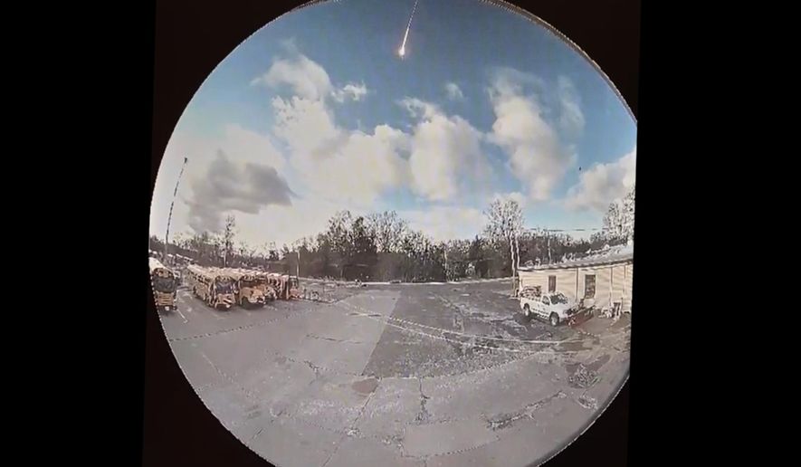 This image made from video shows video taken from a surveillance camera showing a suspected meteor falling through the sky in Olmsted Falls, Ohio, on Tuesday, March, 17, 2026. (Olmsted Falls City Schools via AP)