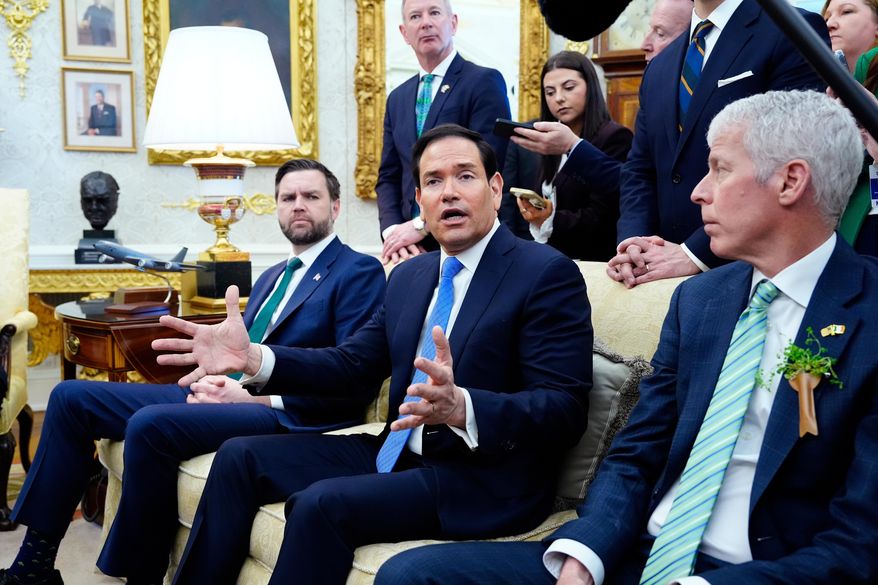 Secretary of State Marco Rubio answers a question about Cuba during a meeting between President Donald Trump and Irish Prime Minister Micheal Martin in the Oval Office of the White House on St. Patrick's Day, Tuesday, March 17, 2026, in Washington. (AP Photo/Alex Brandon) ** FILE **