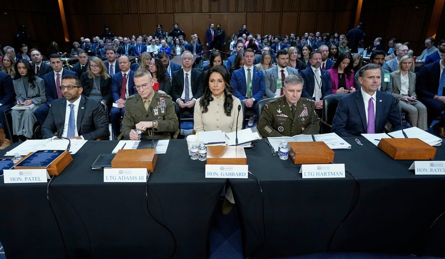 From left, FBI Director Kash Patel, Defense Intelligence Agency Director James Adams, Director of National Intelligence Tulsi Gabbard, Acting Commander of the U.S. Cyber Command William Hartman, and CIA Director John Ratcliffe are seated before the Senate Committee on Intelligence hearings to examine worldwide threats on Capitol Hill Wednesday, March 18, 2026, in Washington. (AP Photo/Jose Luis Magana)