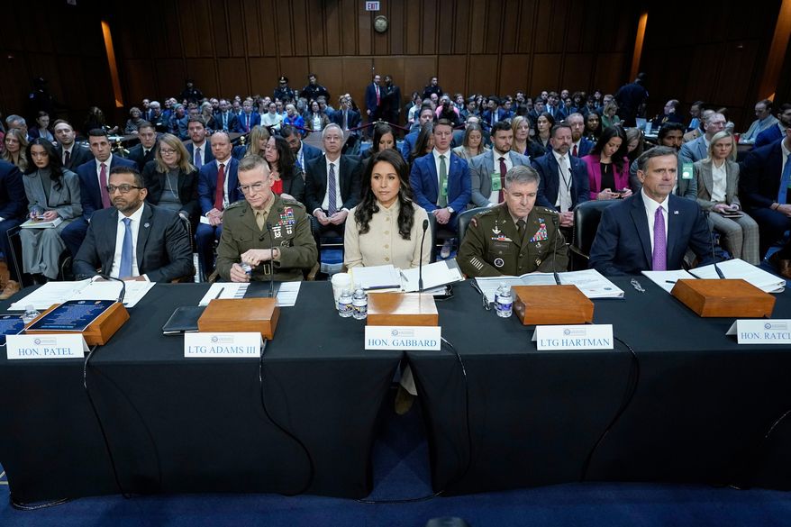 From left, FBI Director Kash Patel, Defense Intelligence Agency Director James Adams, Director of National Intelligence Tulsi Gabbard, Acting Commander of the U.S. Cyber Command William Hartman, and CIA Director John Ratcliffe are seated before the Senate Committee on Intelligence hearings to examine worldwide threats on Capitol Hill Wednesday, March 18, 2026, in Washington. (AP Photo/Jose Luis Magana)
