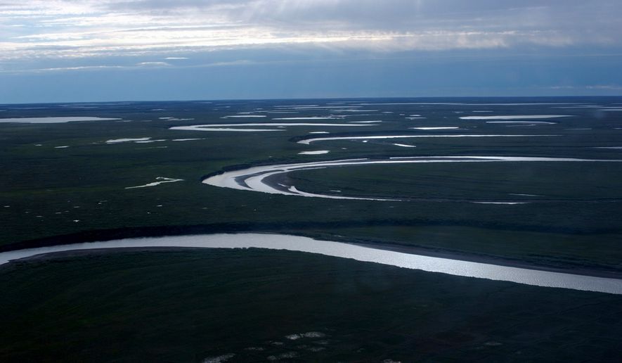 This file photo provided by the United States Geological Survey shows Fish Creek through the National Petroleum Reserve-Alaska, managed by the Bureau of Land Management, on Alaska's North Slope on July 8, 2004. (David W. Houseknecht/United States Geological Survey via AP, File)