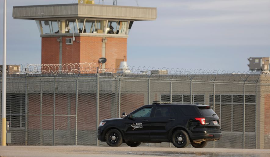 FILE - An Idaho department of corrections vehicle patrols the Idaho State prison complex near Kuna, Idaho on Wednesday, Feb. 28, 2024. (AP Photo/Kyle Green, File)