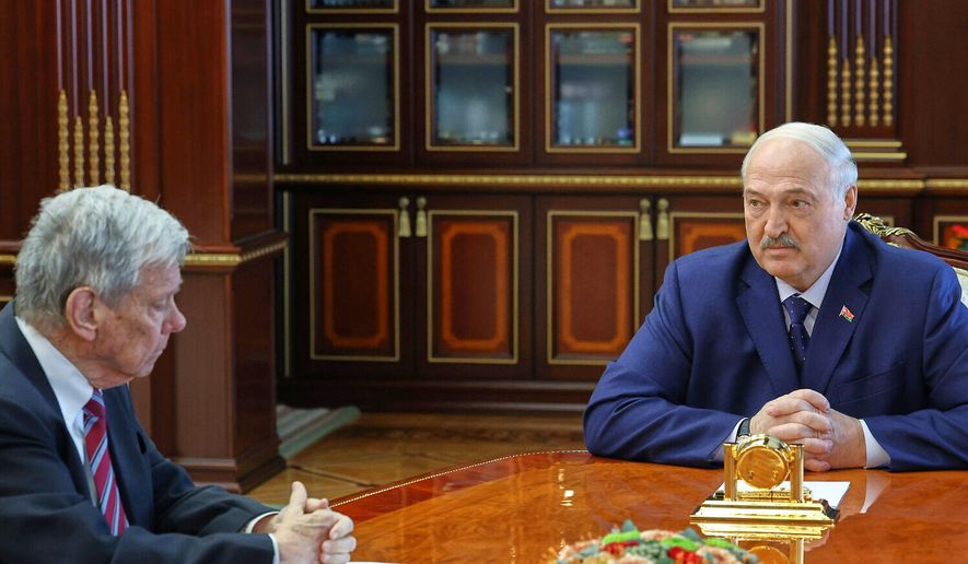 In this photo released by Belarusian presidential press service, Belarusian President Alexander Lukashenko, right, and U.S. Presidential envoy John Coale talk during their meeting in Minsk, Belarus, Thursday, March 19, 2026. (Belarusian Presidential Press Service via AP)