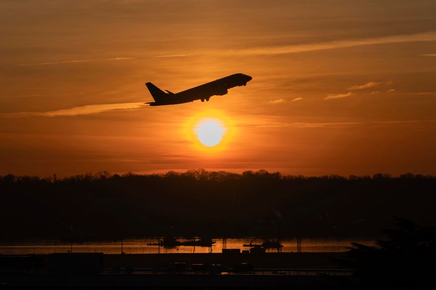 An airplane lifts off from Ronald Reagan Washington National Airport as the sun rises Feb. 3, 2025, in Arlington, Va. (AP Photo/Jose Luis Magana, File)