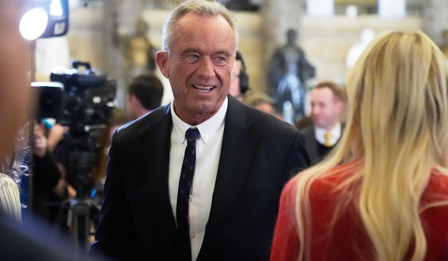 FILE - Health and Human Services Secretary Robert F. Kennedy Jr. arrives before President Donald Trump delivers the State of the Union address to a joint session of Congress in the House chamber at the U.S. Capitol in Washington, Feb. 24, 2026. (AP Photo/Mark Schiefelbein, File)