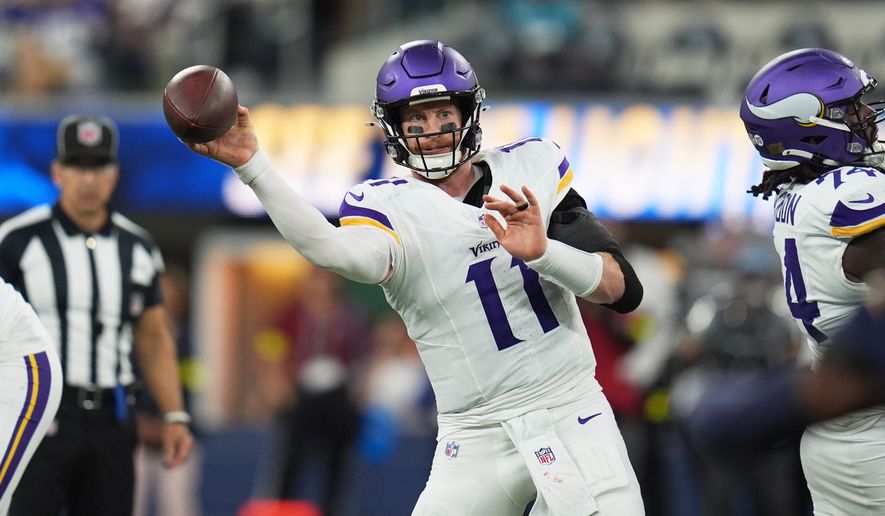 FILE - Minnesota Vikings quarterback Carson Wentz throws a pass during the first half of an NFL football game against the Los Angeles Chargers, Oct. 23, 2025, in Inglewood, Calif. (AP Photo/Gregory Bull, File)