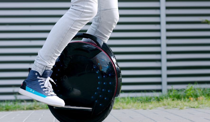 Young man riding an electric unicycle. File photo credit: Monstar Studio via Shutterstock.