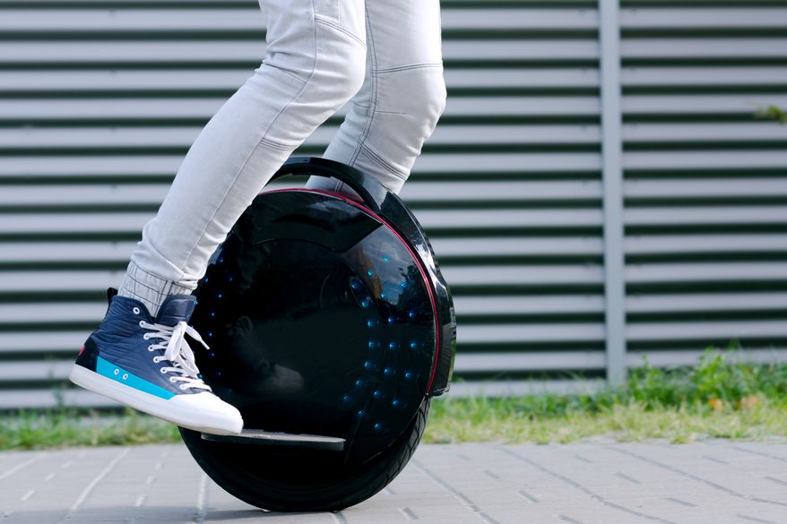 Young man riding an electric unicycle. File photo credit: Monstar Studio via Shutterstock.
