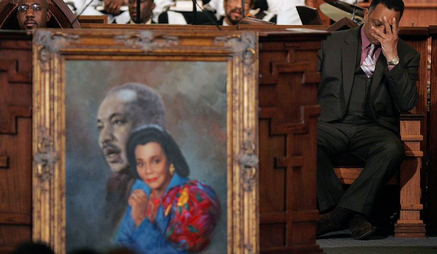 Rev. Jesse Jackson, right, reacts during a prayer service for Coretta Scott King at the new Ebenezer Church on Auburn Ave. in Atlanta Monday, Feb. 6, 2006. Ebenezer Pastor Rev. Raphael Warnock is at left. (AP Photo/John Bazemore, Pool, File)
