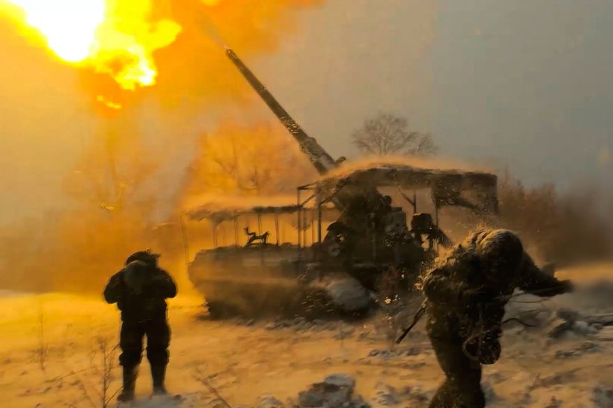 In this image made from video provided by the Russian Defense Ministry Press Service on Jan. 13, 2026, Russian soldiers in Ukraine fire toward Ukrainian positions. (Russian Defense Ministry Press Service via AP, File)