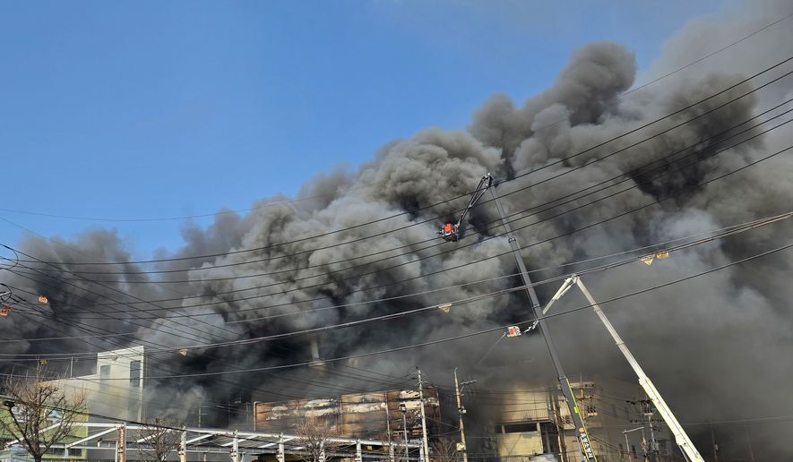 Black smoke rises from an auto parts plant in Daejeon, South Korea, Friday, March 20, 2026. (Kim So-yeon/Yonhap via AP)