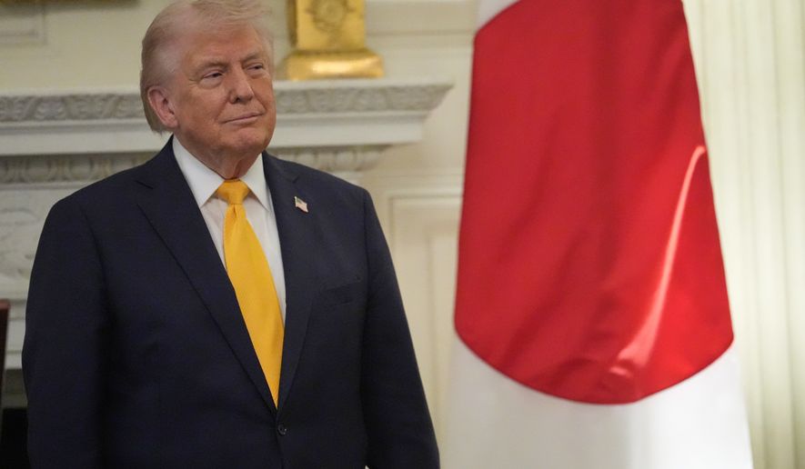 President Donald Trump listens as Japan's Prime Minister Sanae Takaichi speaks during a dinner in the State Dining Room of the White House, Thursday, March 19, 2026, in Washington. (AP Photo/Julia Demaree Nikhinson)