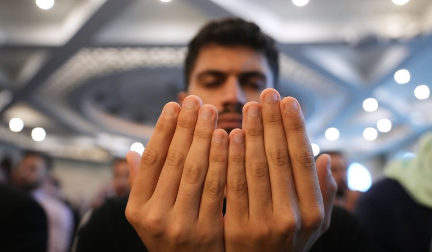 Muslim worshipper Ahmed Alkhekani attends Eid al-Fitr prayer at the Islamic Institute of America in Dearborn Heights, Mich., on Friday, March 20, 2026. (AP Photo/Paul Sancya) **FILE**