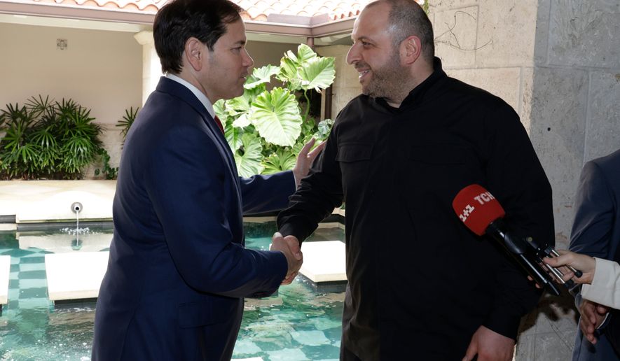 Secretary of State Marco Rubio, left, and Secretary of the National Security of Ukraine Rustem Umerov shake hands, Nov. 30, 2025, in Hallandale Beach, Fla. (AP Photo/Terry Renna, File)