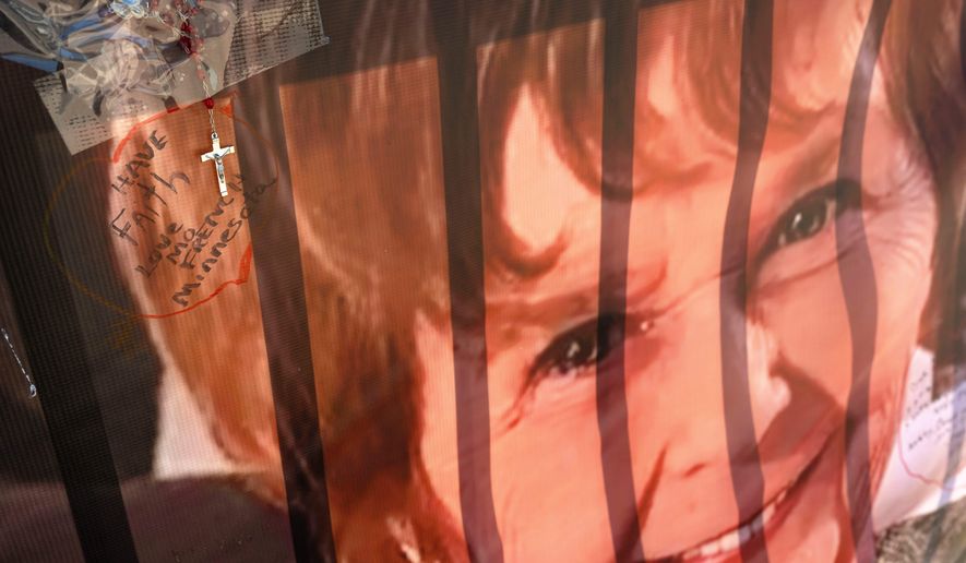 A banner with notes from hundreds of well-wishers for Nancy Guthrie, the missing mother of "Today" show host Savannah Guthrie, is displayed outside of KVOA Newsroom on March 6, 2026, in Tucson, Ariz. (AP Photo/Rebecca Noble, File)