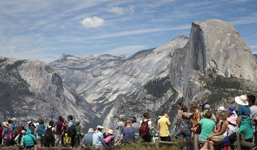People wait for the trailhead at Glacier Point to re-open at Yosemite National Park, Calif., June 18, 2016. (AP Photo/Jacquelyn Martin, File)