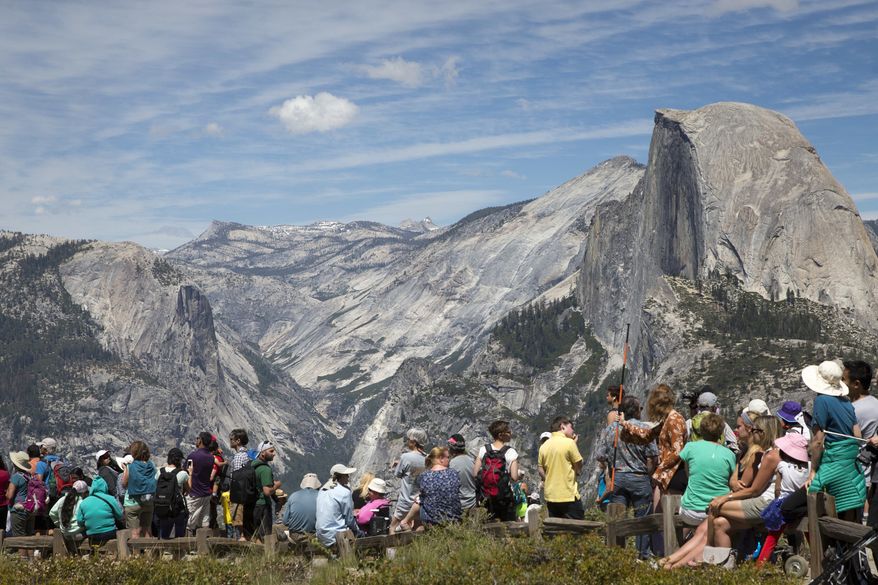 People wait for the trailhead at Glacier Point to re-open at Yosemite National Park, Calif., June 18, 2016. (AP Photo/Jacquelyn Martin, File)