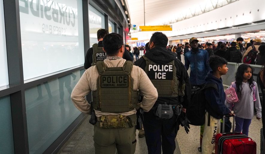 Federal immigration agents walk through Terminal 5 at John F. Kennedy International Airport (JFK) in the Queens borough of New York, Monday, March 23, 2026. (AP Photo/Ryan Murphy) ** FILE **