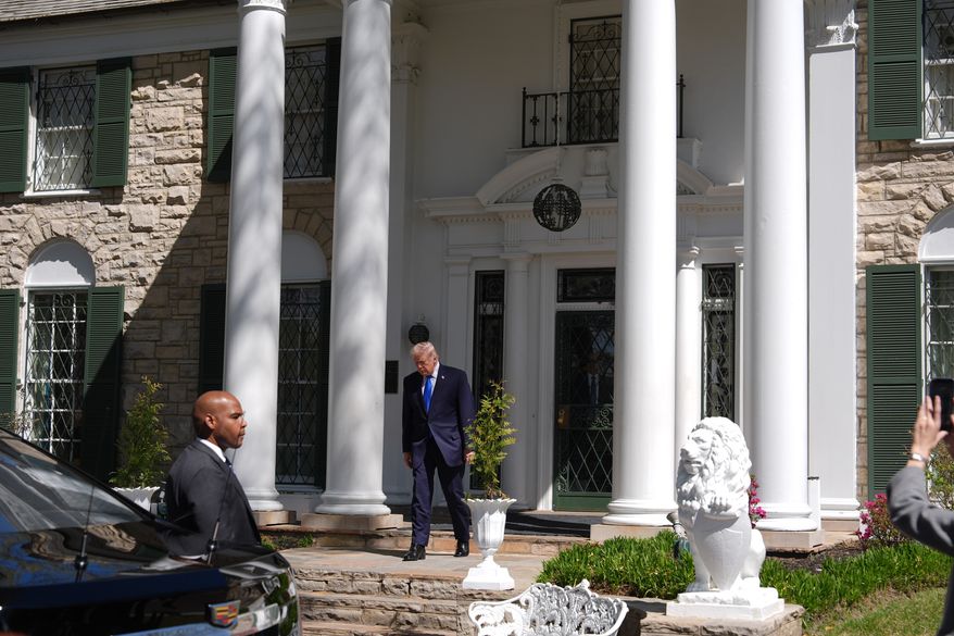 President Donald Trump walks out of Graceland, Elvis Presley's historic estate, after touring, Monday, March 23, 2026, in Memphis, Tenn. (AP Photo/Mark Schiefelbein)