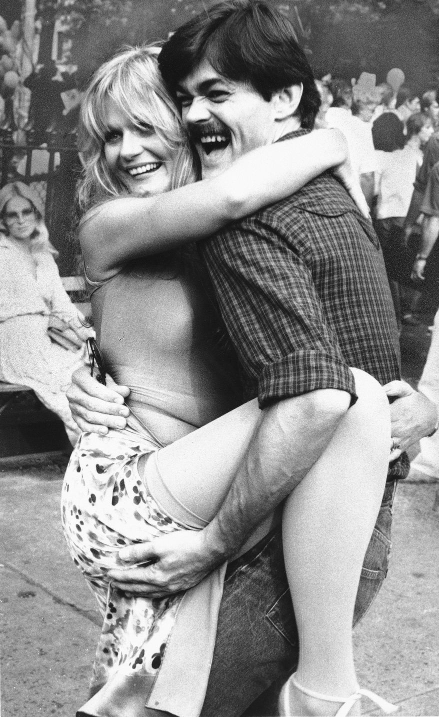 Actress Valerie Perrine and Randy Jones of the disco group the Village People clown around during a break in the filming of the movie "Can't Stop The Music" in New York's Greenwich Village, Aug. 20, 1979. Ms. Perrine and the Village People are among the stars of the film. (AP Photo/Steve Sands)