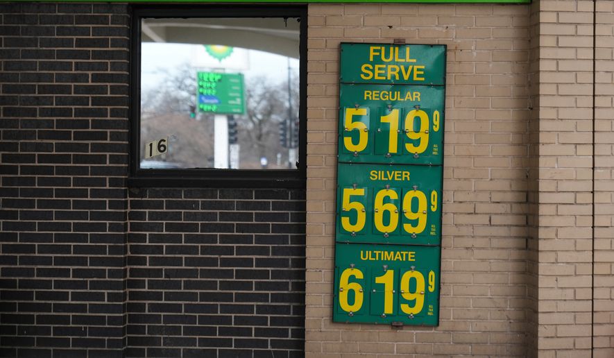 Gas prices are displayed at a station Tuesday, March 24, 2026, in Chicago. (AP Photo/Erin Hooley)