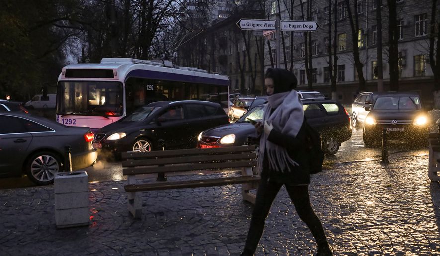 A trolley bus sits idle, unable to move, during a power outage in Chisinau, Moldova, Nov. 23, 2022. (AP Photo/Aurel Obreja, File)
