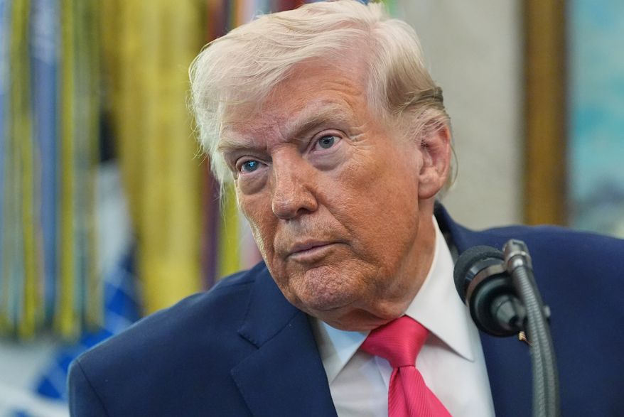 President Donald Trump listens to a reporter during the swearing in for Homeland Security Secretary Markwayne Mullin in the Oval Office of the White House, Tuesday, March 24, 2026, in Washington. (AP Photo/Alex Brandon)