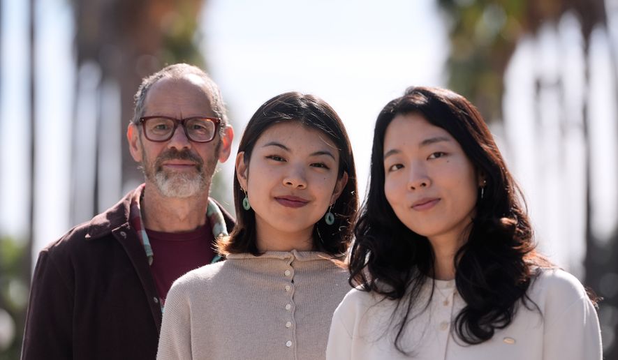 Dan Jurafsky, Stanford professor of computer science and linguistics, from left, Myra Cheng, Stanford Ph.D. candidate in computer science, and Cinoo Lee, Stanford postdoctoral fellow in psychology, pose for photos on the university campus in Stanford, Calif., Thursday, March 26, 2026. (AP Photo/Jeff Chiu)
