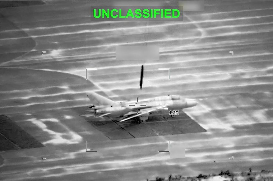 This partially redacted image from a video provided by U.S. Central Command shows a military aircraft in Iran shortly before it was struck by a missile fired by U.S. forces on Sunday, March 1, 2026. (U.S. Central Command via AP) ** FILE **