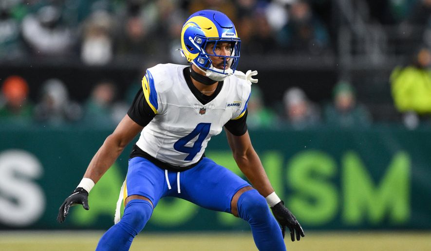 FILE - Los Angeles Rams cornerback Ahkello Witherspoon (4) prepares to defend during the first half of an NFL divisional playoff football game against the Philadelphia Eagles, Jan. 19, 2025, in Philadelphia. (AP Photo/Terrance Williams, File)