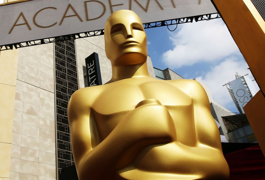 An Oscar statue appears outside the Dolby Theatre for the 87th Academy Awards in Los Angeles on Feb. 21, 2015. (Photo by Matt Sayles/Invision/AP, File)