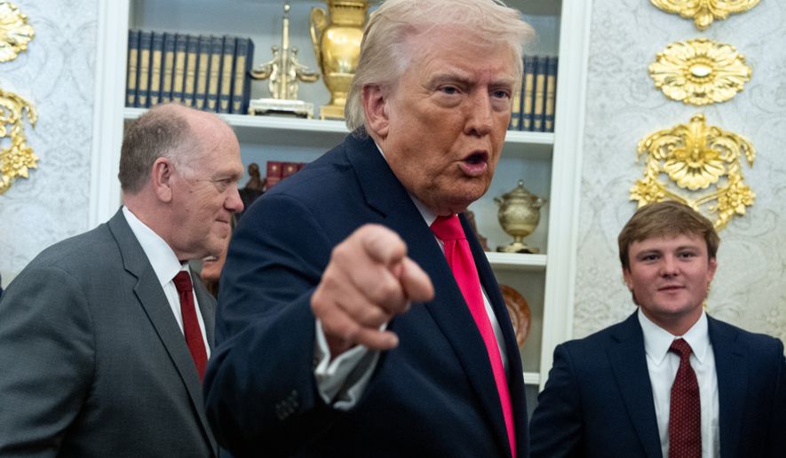 President Donald Trump speaks with reporters during the swearing in ceremony for Homeland Security Secretary Markwayne Mullin in the Oval Office of the White House, Tuesday, March 24, 2026, in Washington. (AP Photo/Alex Brandon)