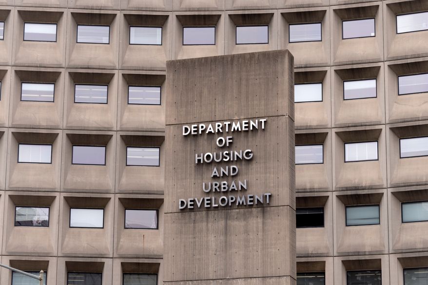 A sign for the Department of Housing and Urban Development stands outside the agency's headquarters in Washington on Jan. 16, 2026. (AP Photo/Mark Schiefelbein) **FILE**