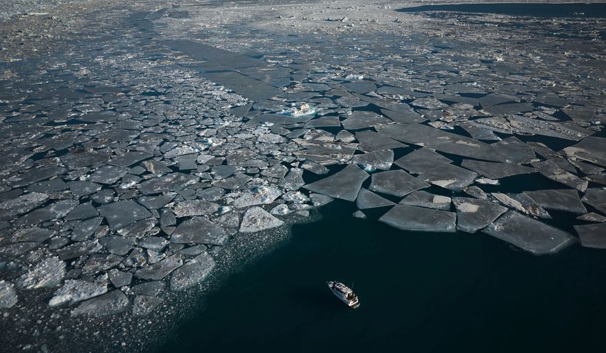 FILE - Pieces of ice move through the sea in Qoornoq Island, near Nuuk, Greenland, Feb. 17, 2025. (AP Photo/Emilio Morenatti, File)