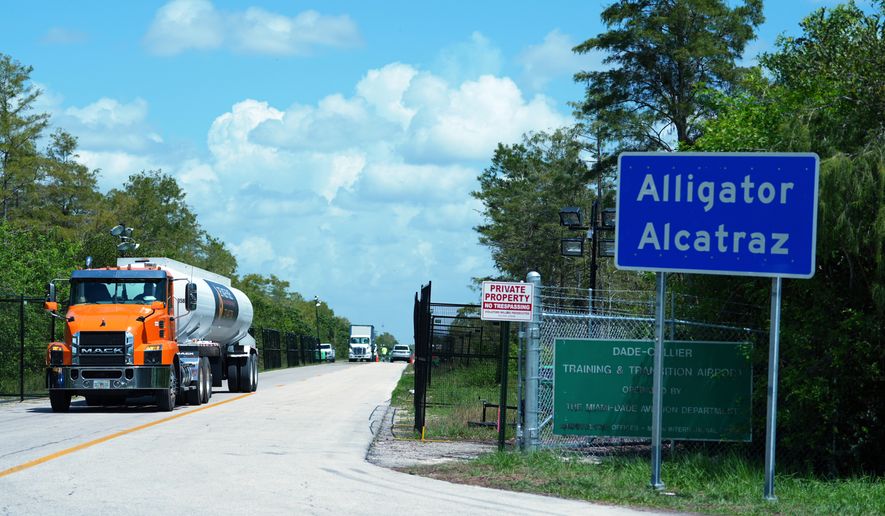 FILE - Trucks come and go from the "Alligator Alcatraz" immigration detention center in the Florida Everglades, Thursday, Aug. 28, 2025, in Collier County, Fla. (AP Photo/Rebecca Blackwell, File)