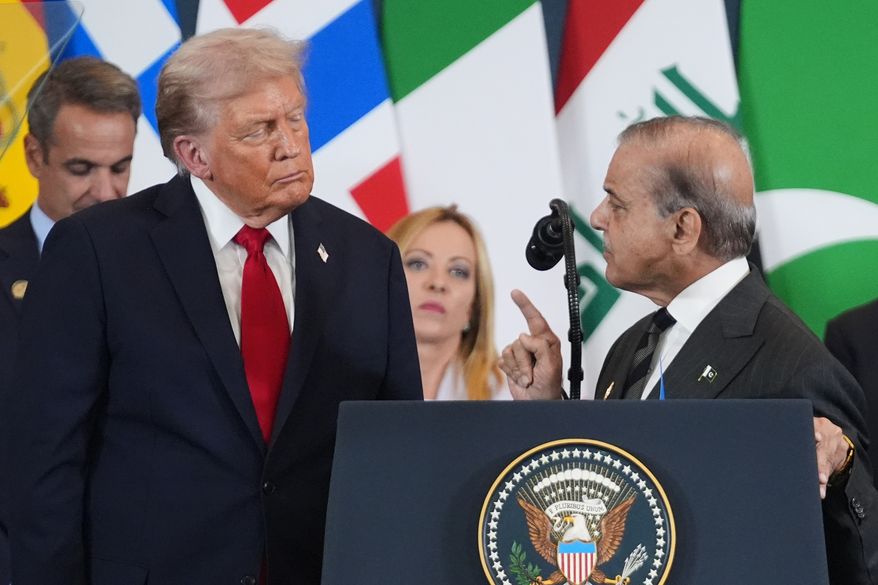 President Donald Trump, left, listens as Pakistan's Prime Minister Shehbaz Sharif speaks during a summit to support ending the more than two-year Israel-Hamas war in Gaza after a breakthrough ceasefire deal, on Oct. 13, 2025, in Sharm El Sheikh, Egypt. (AP Photo/Evan Vucci, File)