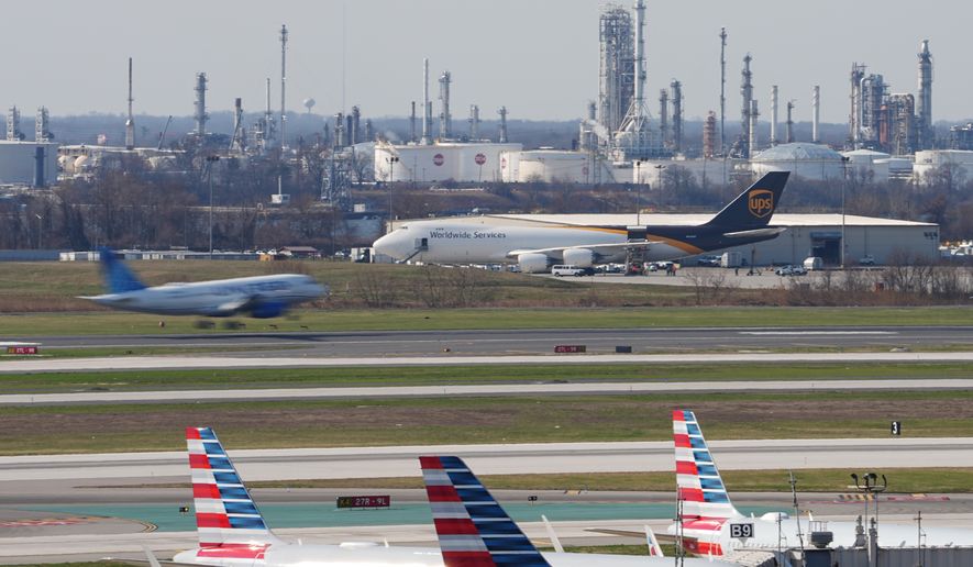 An airplane lands in view of a refinery at Philadelphia International Airport in Philadelphia, Thursday, March 26, 2026. (AP Photo/Matt Rourke)