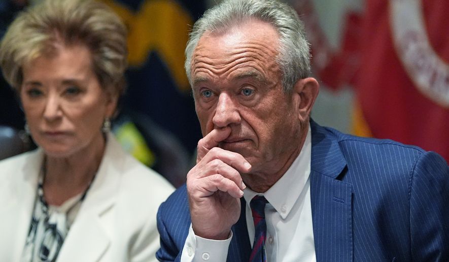 Education Secretary Linda McMahon and Secretary of Health and Human Services Robert F. Kennedy, Jr. listen during a Cabinet meeting at the White House, Thursday, March 26, 2026, in Washington. (AP Photo/Alex Brandon)