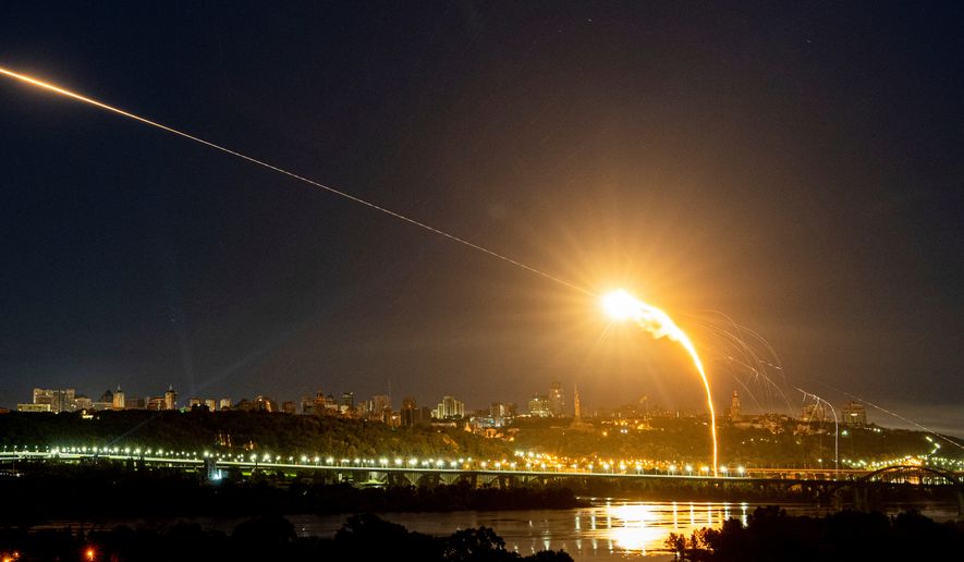 Ukrainian air defense intercepts a Shahed drone midair in the third Russian aerial attack on the capital in the last 24 hours in Kyiv, Ukraine, on Tuesday, May 30, 2023. (AP Photo/Evgeniy Maloletka, File)