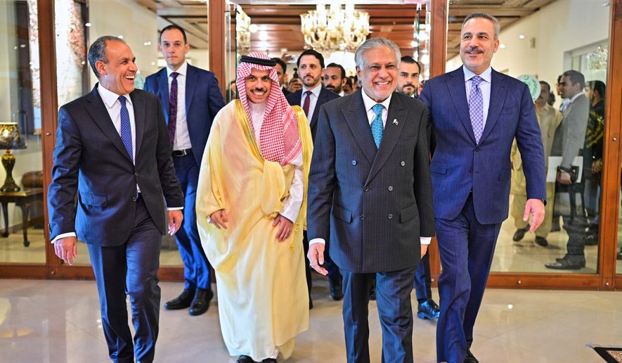 In this photo released by the Pakistan Ministry of Foreign Affairs, from left, Egyptian Foreign Minister Badr Abdelatty, Saudi Arabia's Foreign Minister Prince Faisal bin Farhan Al-Saud, Pakistan's Foreign Minister Ishaq Dar and Turkish Foreign Minister Hakan Fidan walk prior to their meeting to discuss the Middle East war, in Islamabad, Pakistan, Sunday, March 29, 2026. (Pakistan Ministry of Foreign Affairs via AP)