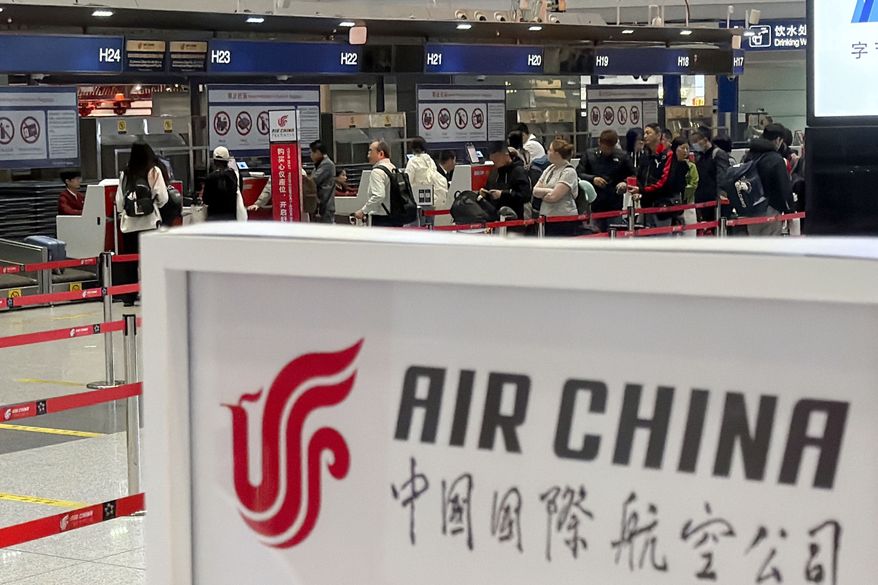 People line up in front of an Air China's counter for a direct flight between Beijing and North Korea's capital of Pyongyan, at Beijing Capital International Airport in Beijing on Monday, March 30, 2026. (Iori Sagisawa/Kyodo News via AP) **FILE**