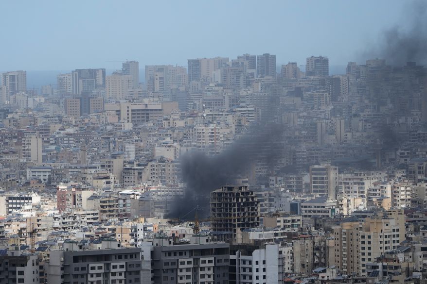 Smoke rises following an Israeli airstrike in Dahiyeh, Beirut's southern suburbs, Lebanon, Monday, March 30, 2026. (AP Photo/Bilal Hussein)
