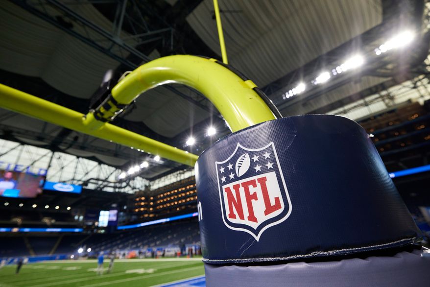 In this Aug. 13, 2021, photo, an NFL logo is displayed on a goalpost pad during an NFL preseason football game between the Buffalo Bills and the Detroit Lions in Detroit. (AP Photo/Rick Osentoski) **FILE**