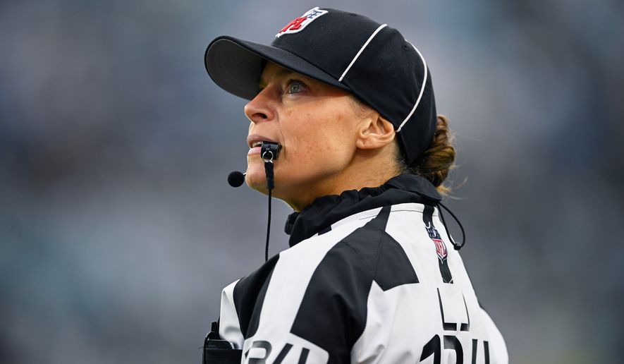 FILE - Line judge Robin DeLorenzo looks on during the second half of an NFL football game between the Jacksonville Jaguars and the Tennessee Titans, Dec. 29, 2024, in Jacksonville, Fla. (AP Photo/Phelan M. Ebenhack, File)