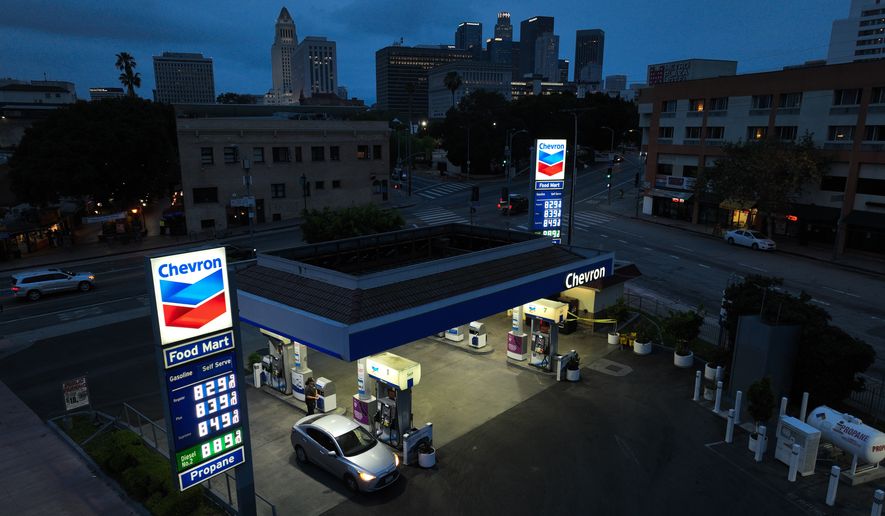 Gas prices are displayed at a Chevron gas station, in downtown Los Angeles, Tuesday, March 31, 2026. (AP Photo/Jae C. Hong)