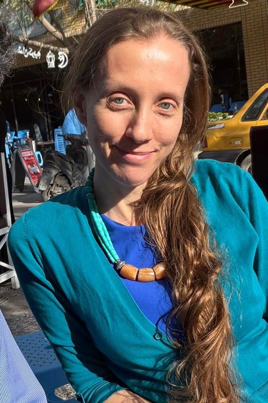 U.S. journalist Shelly Kittleson poses for a cellphone photo in a cafe in Baghdad, Iraq, Monday, March 30, 2026. (AP Photo)